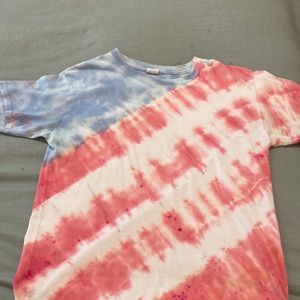 Red, white, and blue tie-dyed shirt.